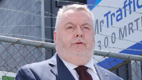 Counsel assisting the inquiry Patrick Wheelahan and Commissioner Stuart Wood outside a traffic management company on the Gold Coast.