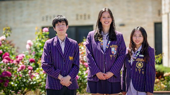 Wesley College students Sunny Wong, Kirwan Schoenborn and Yanxi ( Sissi ) Li receive their IB scores.