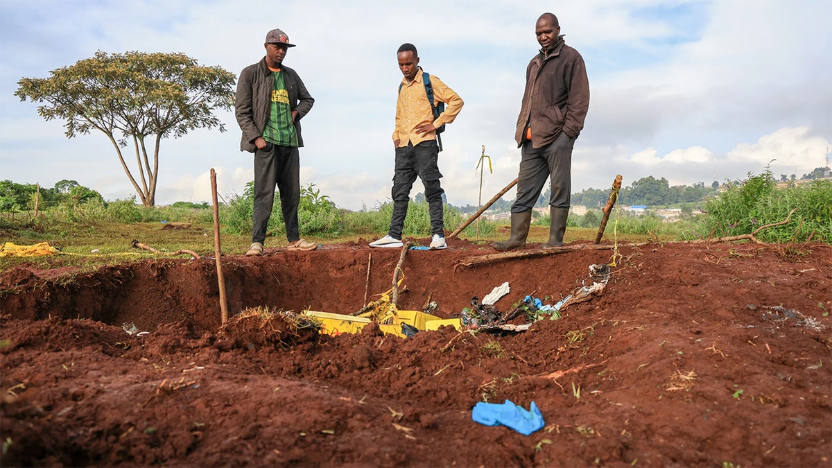 workers survey Kenya mass grave