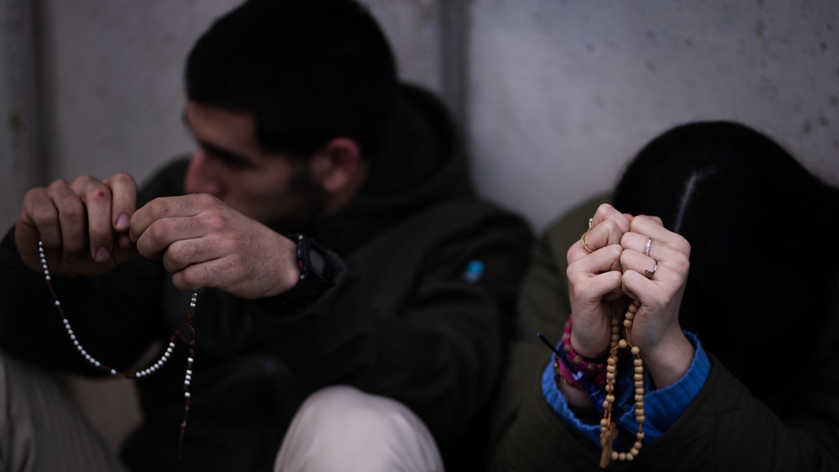 People praying in Spain.