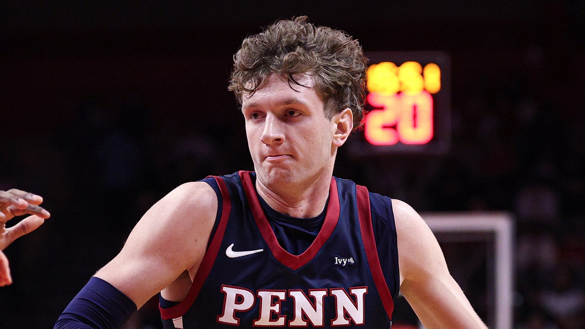 TJ Power dribbles to hoop