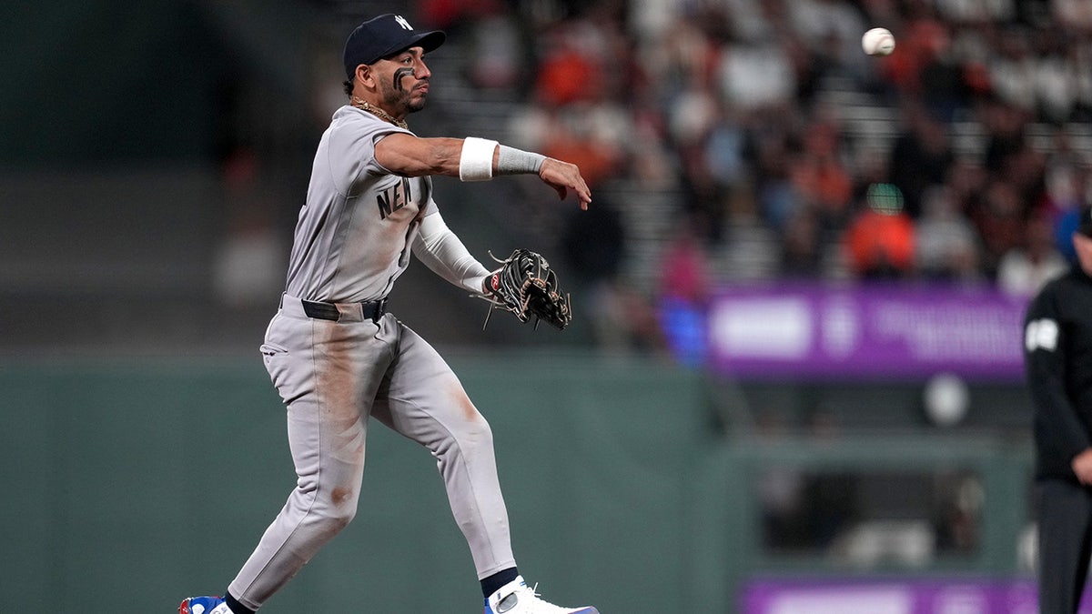 José Caballero throws to first