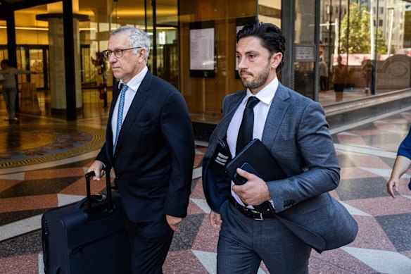 Daniel Drakopoulos (right) leaves the Downing Centre Local Court on Thursday.