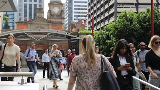 Commuters arriving in the Brisbane CBD on Wednesday morning. 