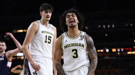 Michigan holds off UConn to capture first men's basketball national title since 1989