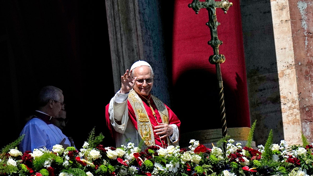 Pope Leo XIV delivering the Urbi et Orbi blessing from St. Peter's Basilica balcony