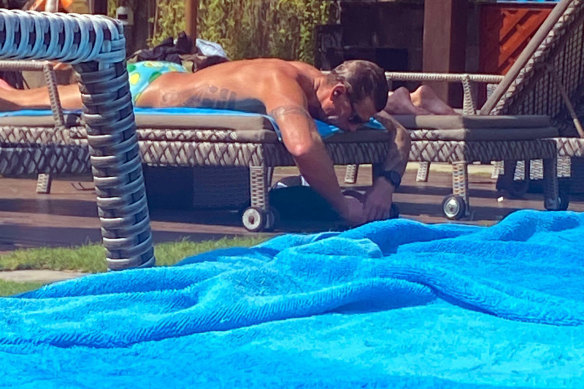 Ben Roberts-Smith relaxing by a pool in Bali on the day of the defamation verdict.