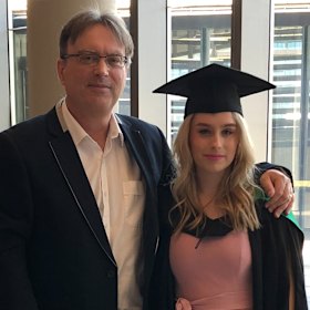 Stephanie with her father, Paul, at her graduation in September, 2018.