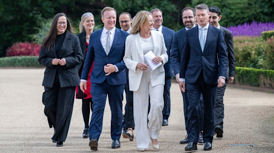 The new Allan ministry at the swearing-in ceremony at Government House on Wednesday.