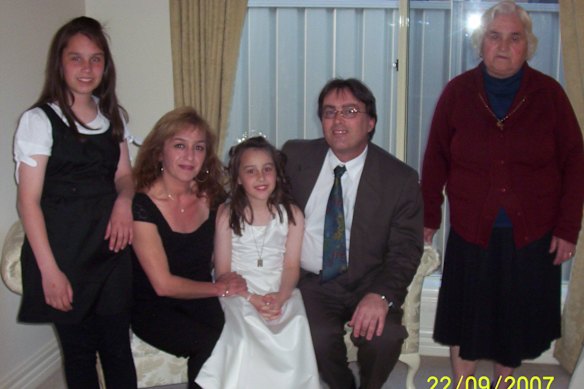 The family in 2007, celebrating Krystal’s First Communion. From left: Stephanie, Marie, Krystal, Paul and grandmother Samantha.