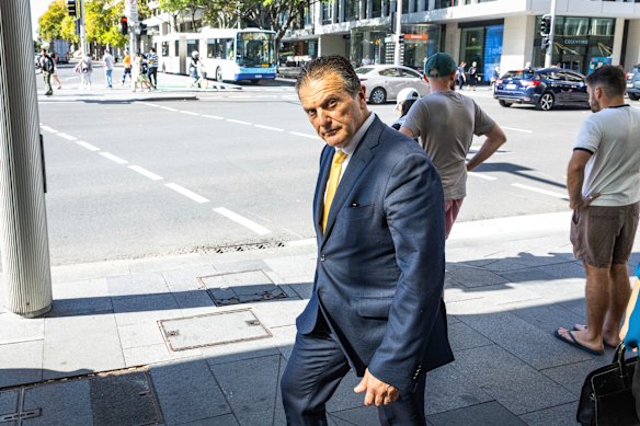 Hospitality mogul Bill Drakopoulos leaves the Downing Centre after his son’s sentencing. 