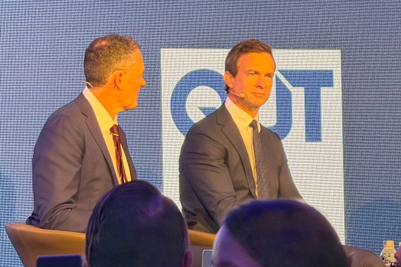 Brisbane Lions chief executive Sam Graham (left) and his Broncos counterpart, Dave Donaghy, speaking on Thursday.