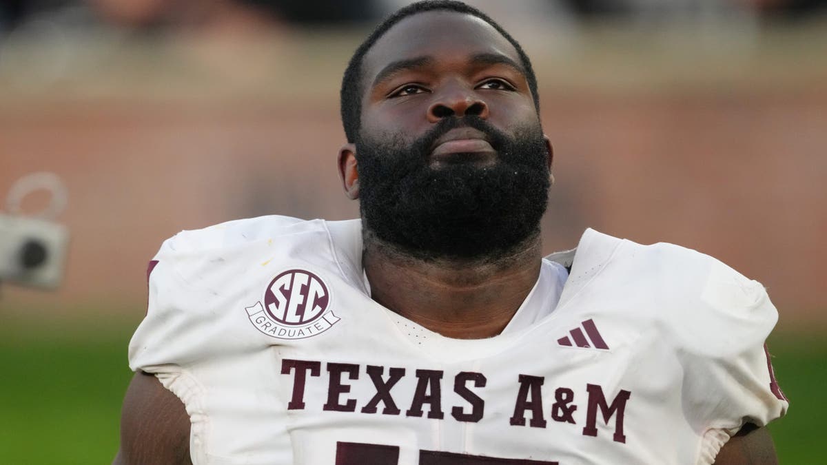 Albert Regis looks on during a game at Faurot Field