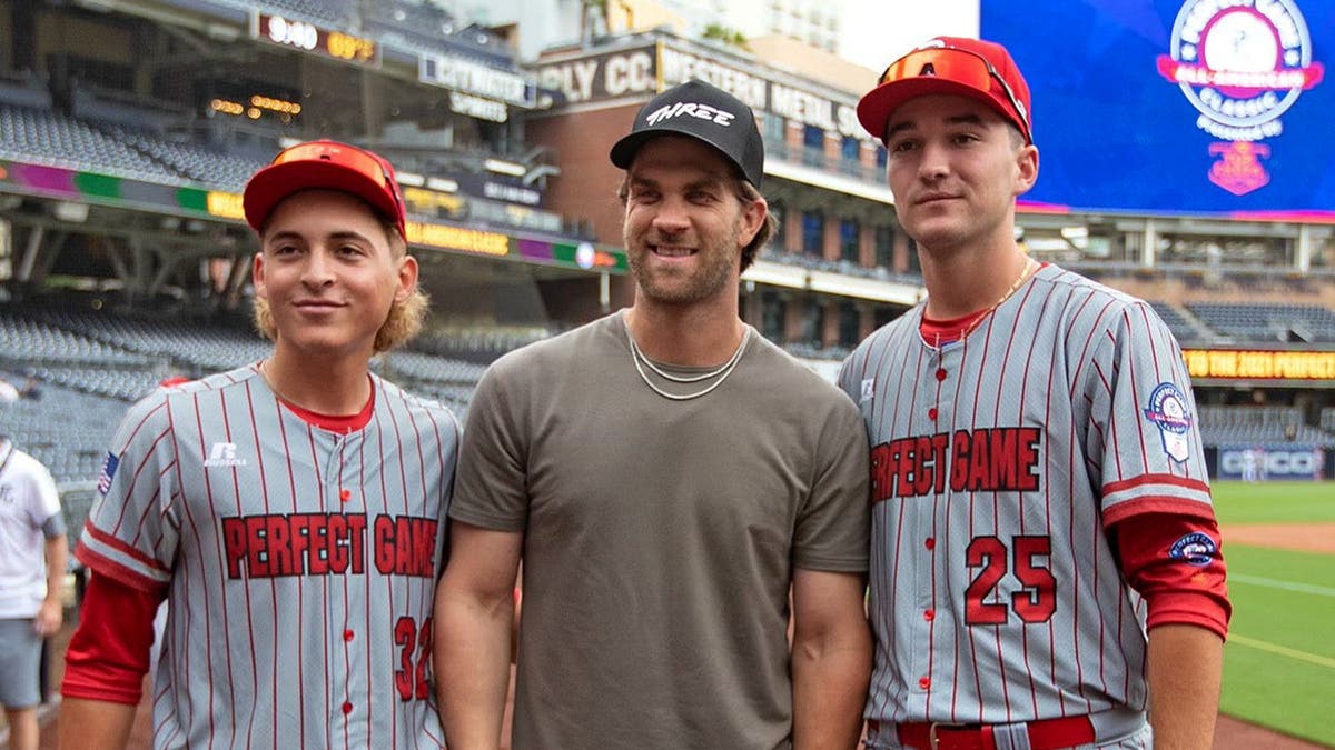 Bryce Harper poses with players