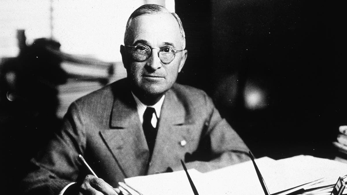 Harry S Truman standing and looking forward