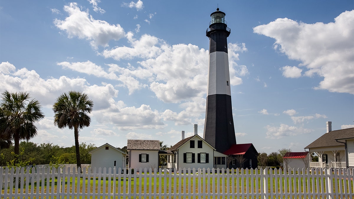 Tybee Island Lighthouse standing under a partly cloudy sky near Savannah, Georgia