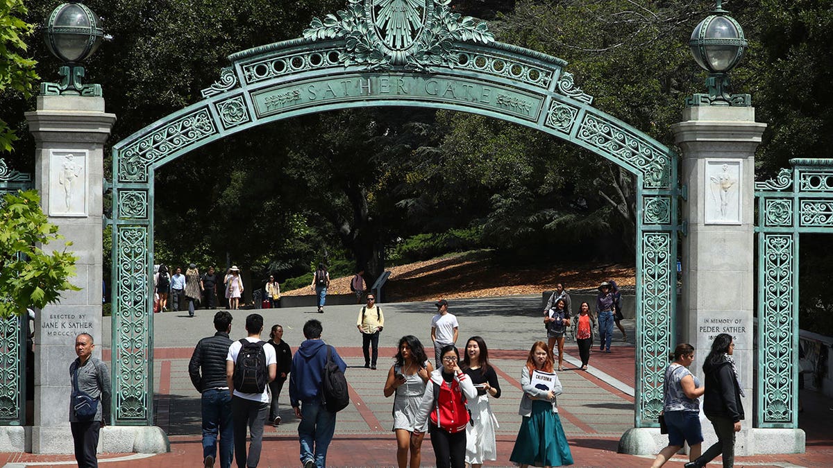Students walking past Sather Gate on University of California Berkeley campus