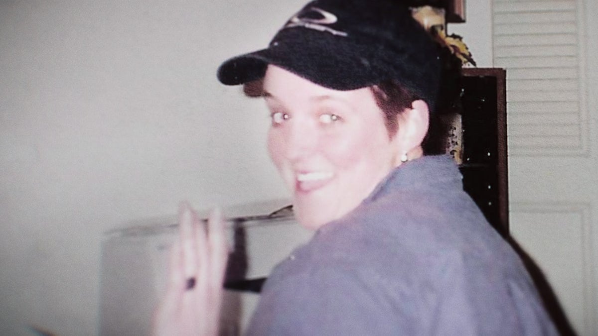 Amy Bradley wearing a grey shirt and a black cap.