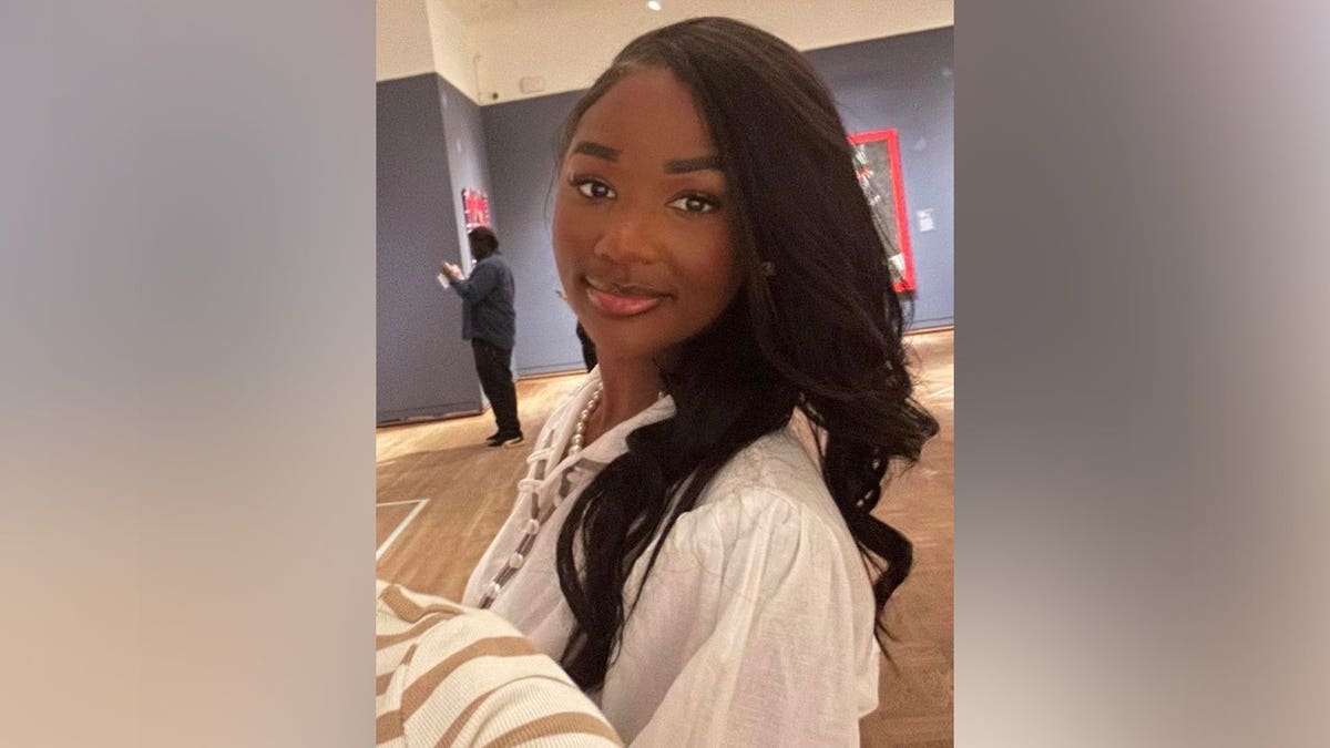 Ashlee Jenae smiling in a close-up portrait