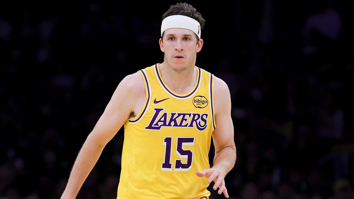 Austin Reaves dribbling basketball during NBA game in Los Angeles