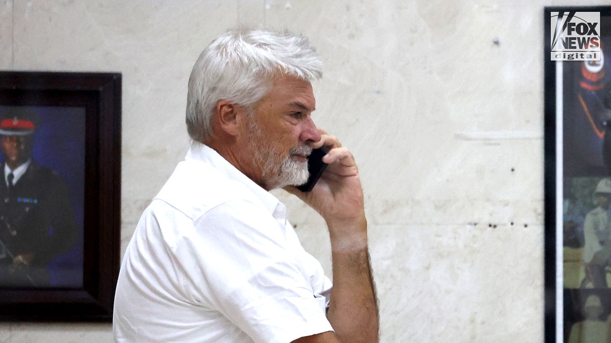 Brian Hooker leaves police station in The Bahamas, with lawyer