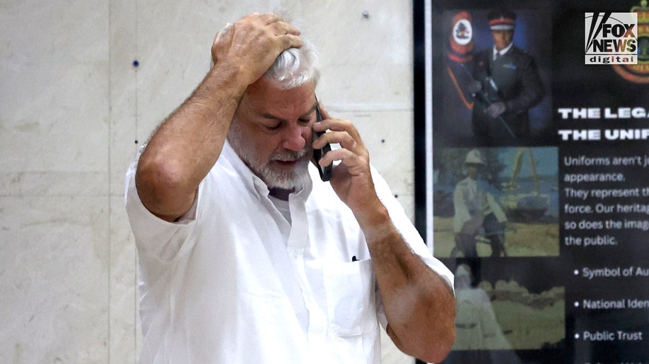 Brian Hooker leaves police station in The Bahamas, with lawyer