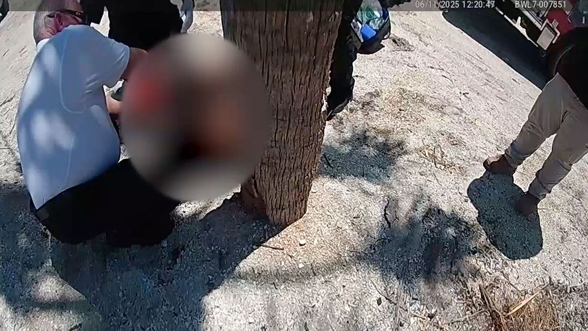 First responders treating 9-year-old Leah Lendel after shark bite