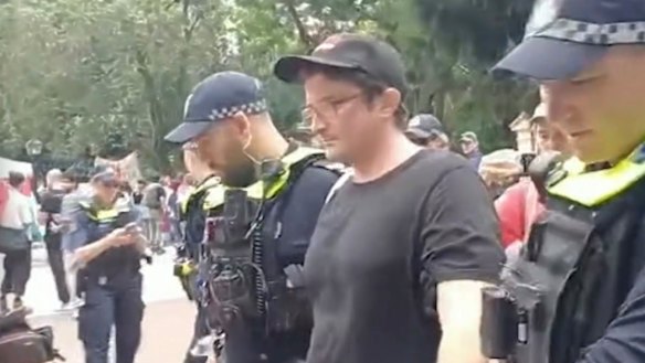 Parry during his arrest outside Parliament House in Brisbane.