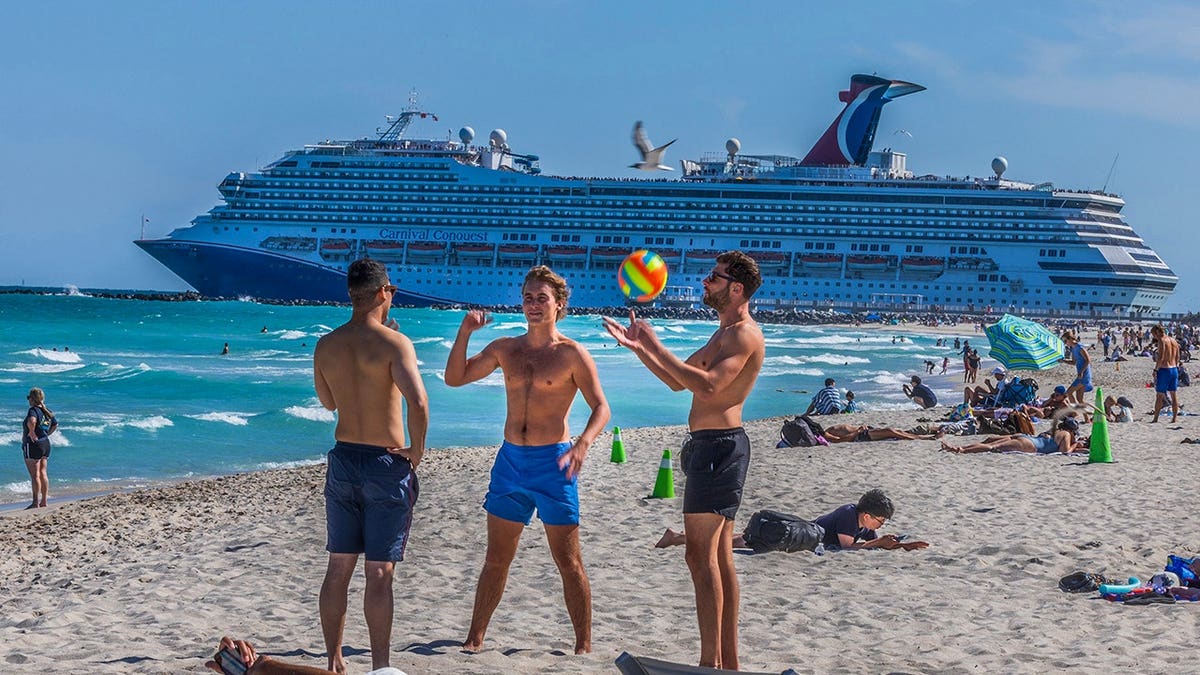 The Carnival Conquest cruise ship departing PortMiami through Government Cut channel