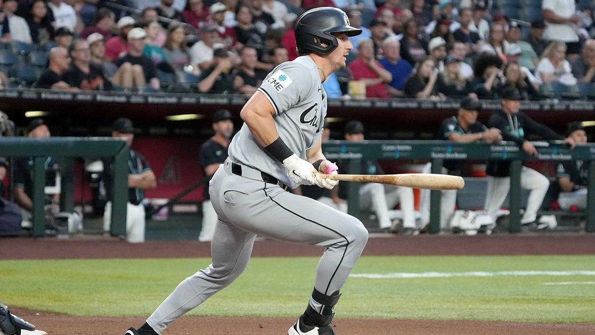 Colson Montgomery hitting a baseball during a game at Chase Field.