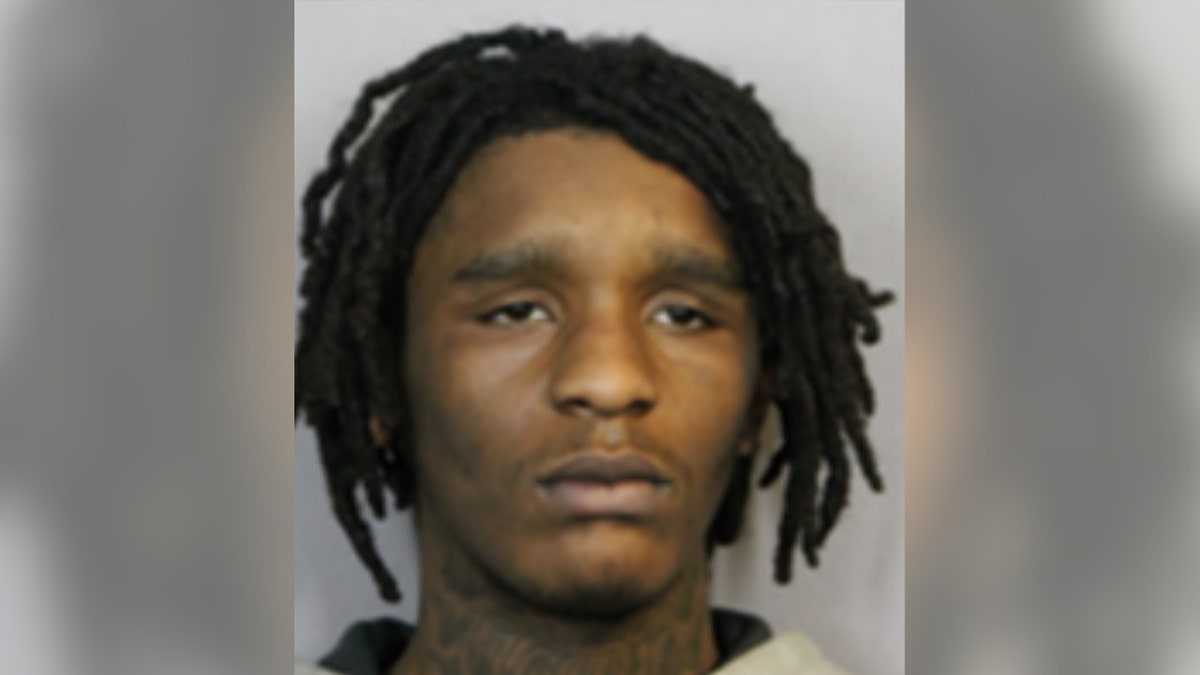 Naqwan Lucas posing for a booking photo by Metropolitan Police Department