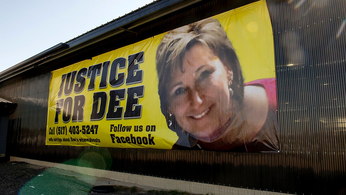 A "justice for Dee" banner