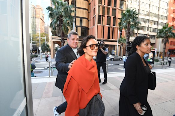 Amanda Ghost, centre, outside the Federal Court on Wednesday.