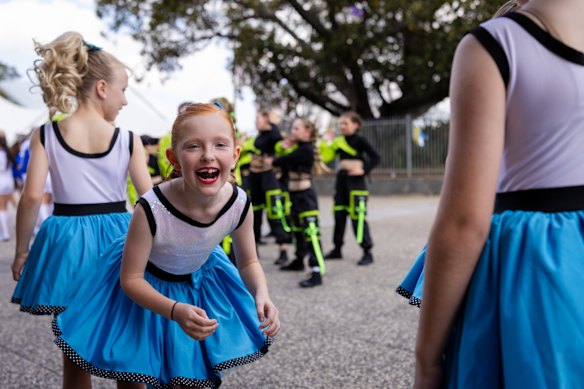 Girls in the Nikki Webster dance group prepare for a Good Friday performance.