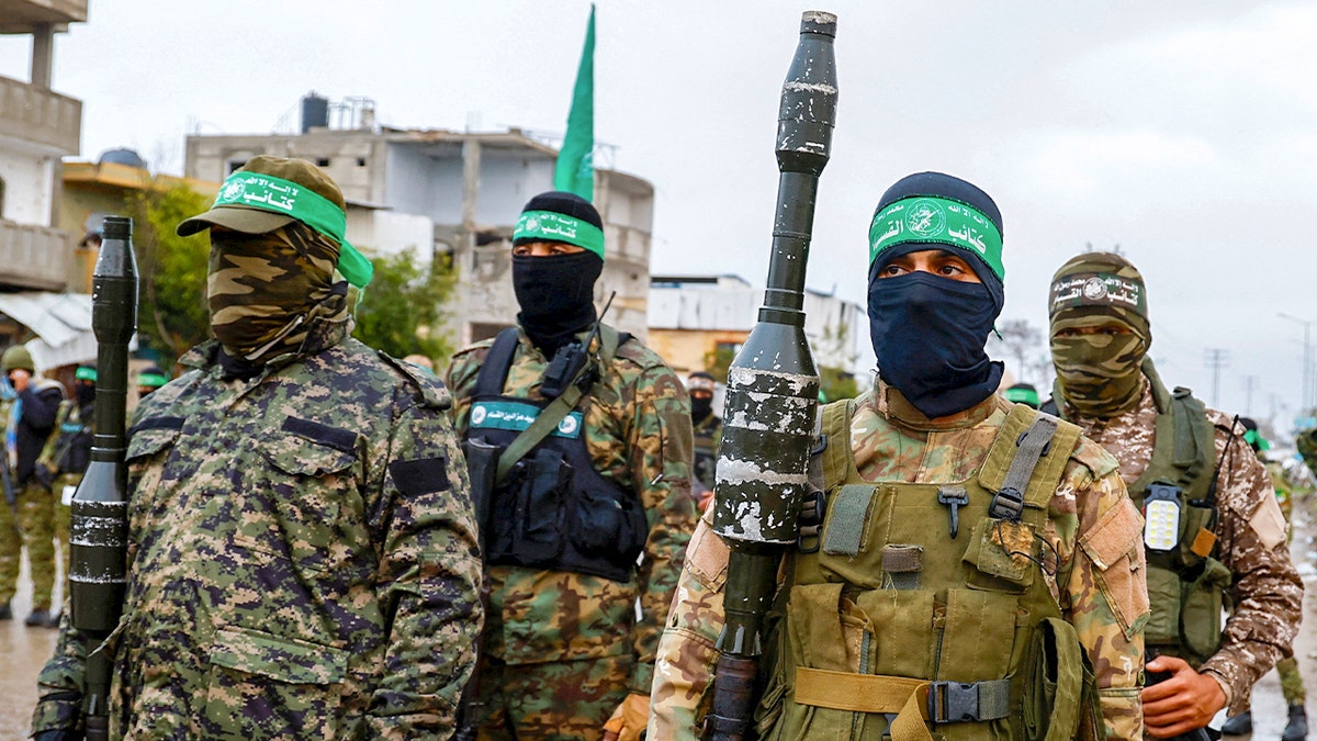 Hamas terrorists standing guard with weapons in Rafah southern Gaza Strip
