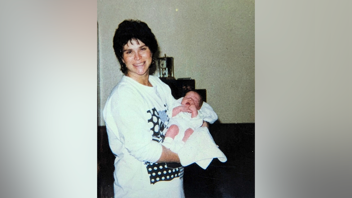 Janice Randle holding her baby in photo before 1992 homicide case in Washington
