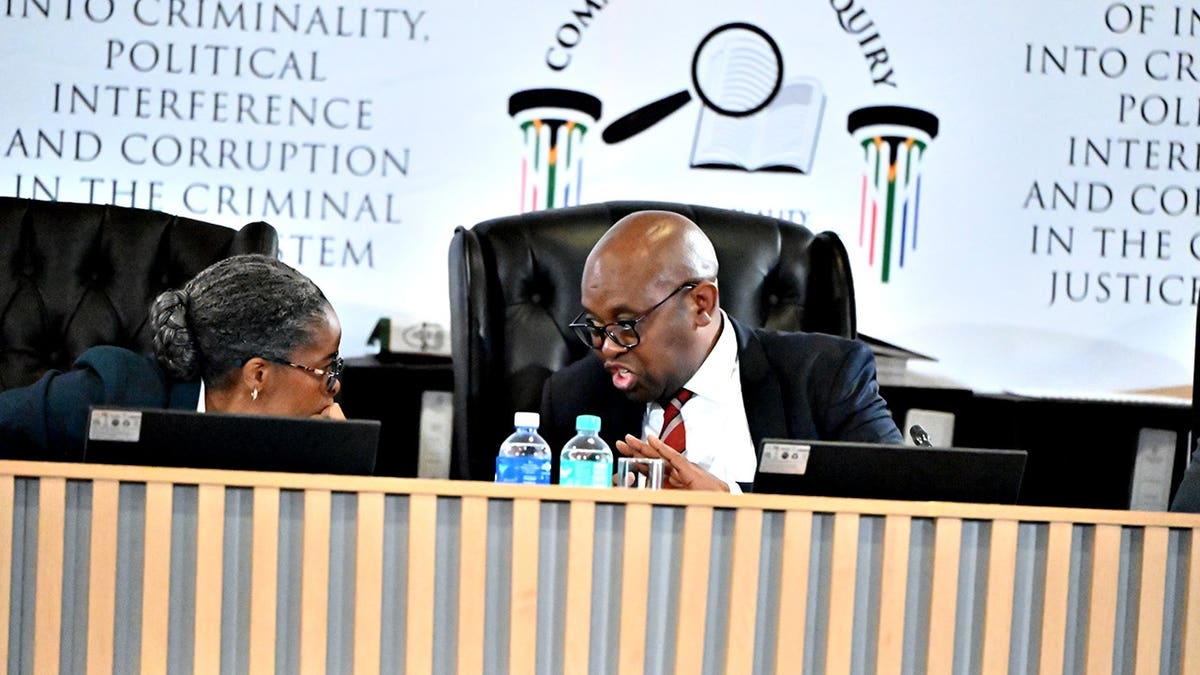 Advocate Sesi Baloyi SC and Mbuyiseli Madlanga seated at the Madlanga Commission of Inquiry in Pretoria