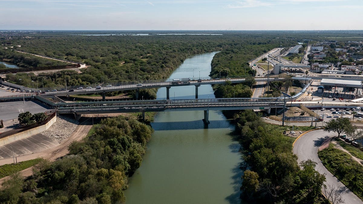 The McAllen-Hidalgo International Bridge spanning a river in McAllen, Texas