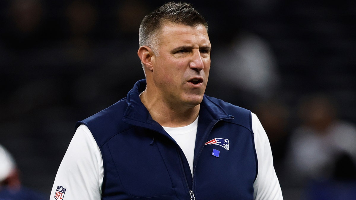 Mike Vrabel on the field before warmups