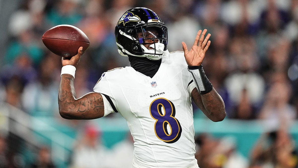 Baltimore Ravens quarterback Lamar Jackson throws a football during a game against the Miami Dolphins