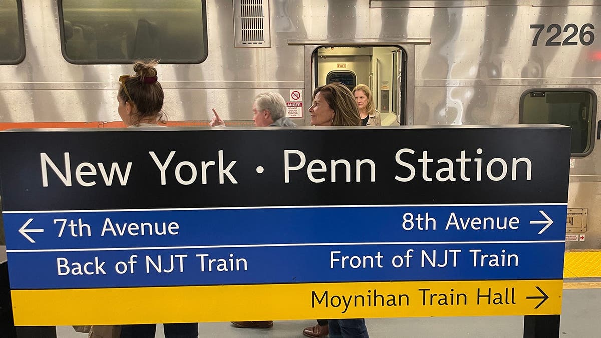 NJ Transit riders getting off a train at New York Penn Station