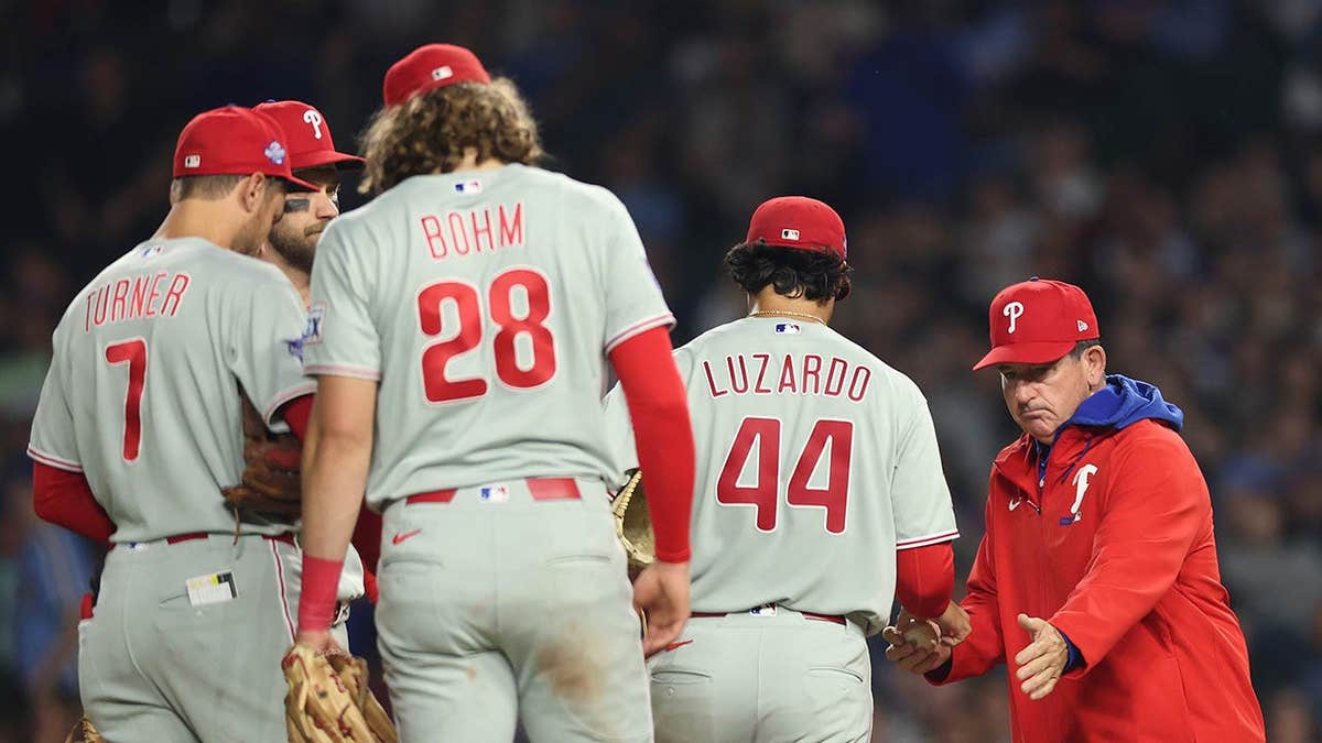 Manager Rob Thomson removing Jesús Luzardo from the game at Wrigley Field