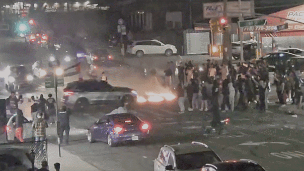 Queens from Drag Race performing on a city street