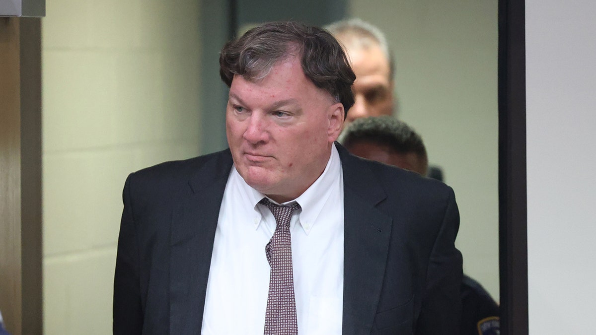 Rex A. Heuermann escorted into courtroom at Suffolk County Court in Riverhead
