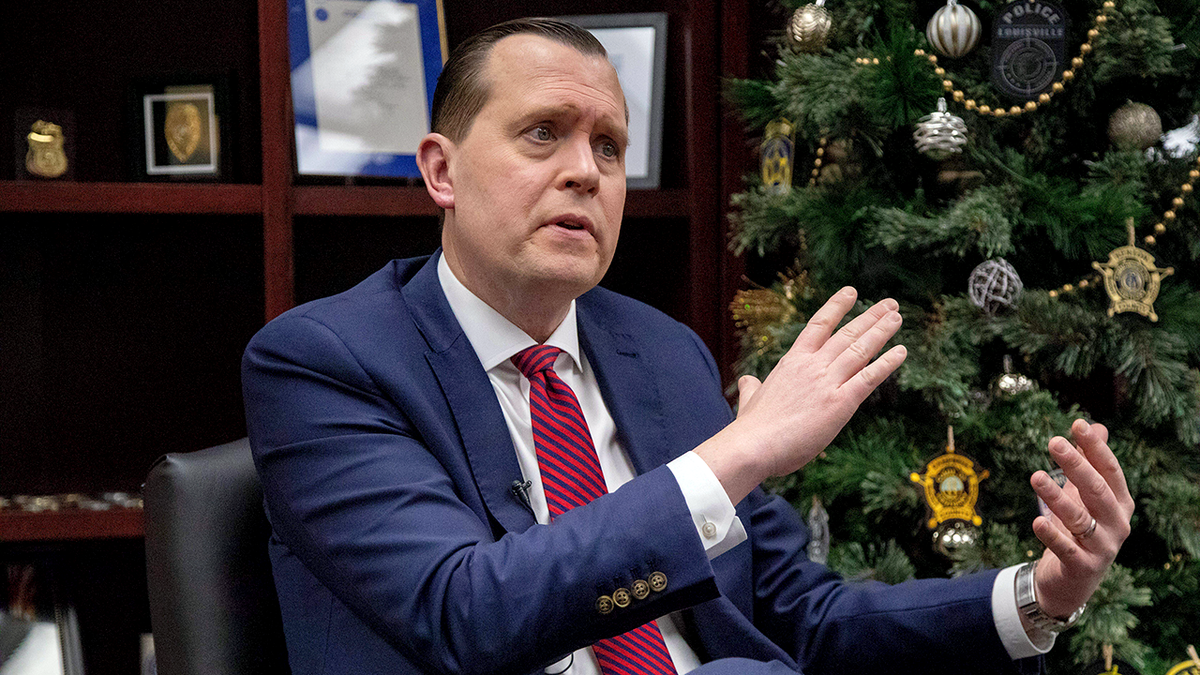 Kentucky Attorney General Russell Coleman standing and looking forward