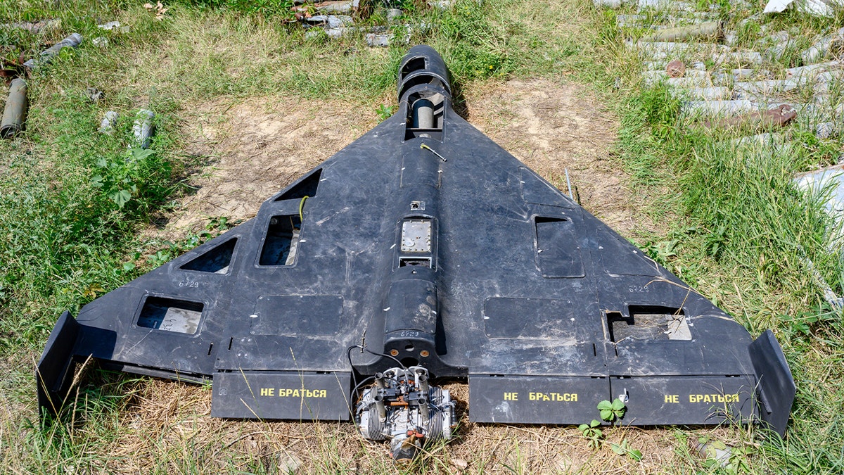 Remains of a Shahed-136 drone displayed with other damaged weapons in Kharkiv