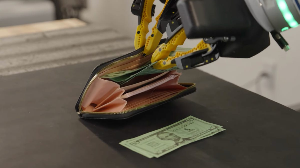 Watch a Robot Stuff Cash Into a Wallet Just Like You Do
