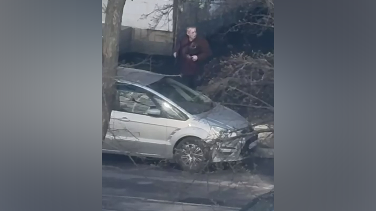 The gunman was seen holding and shooting a weapon in the street.