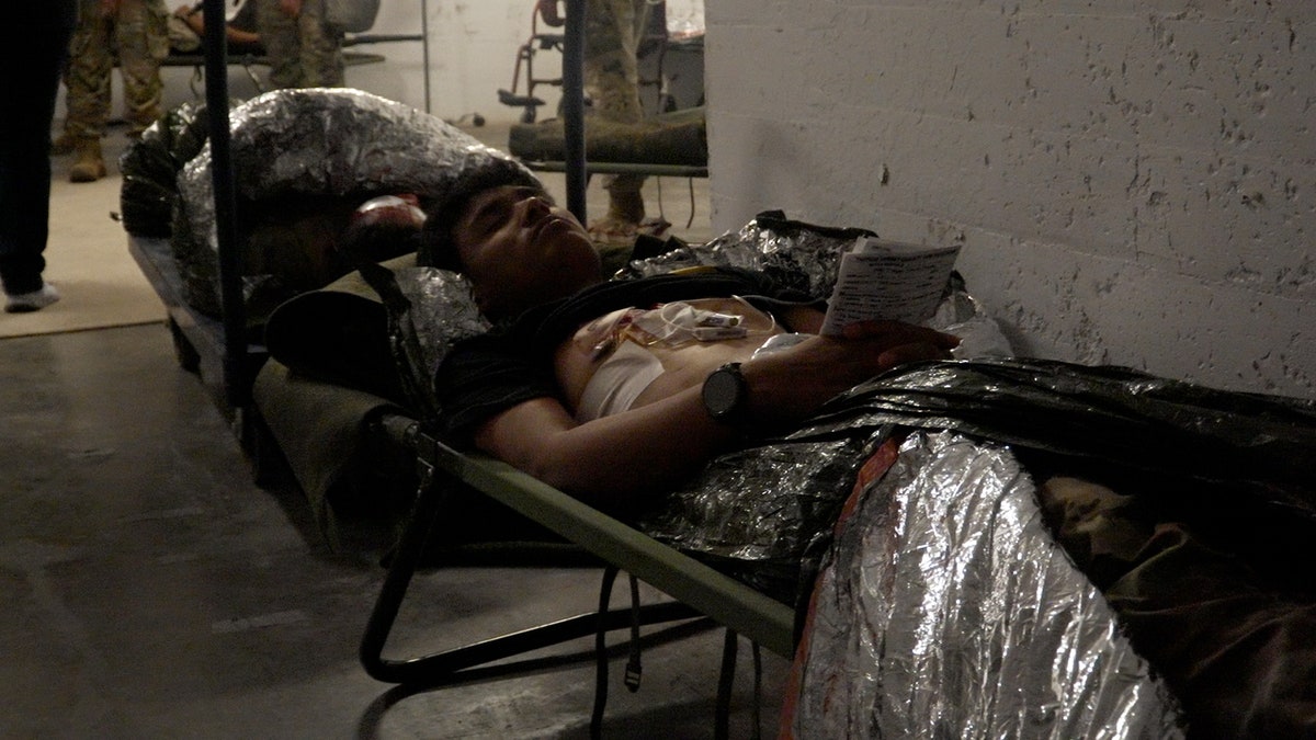 "Operation Silver Lightning" role players imitate wounded soldiers