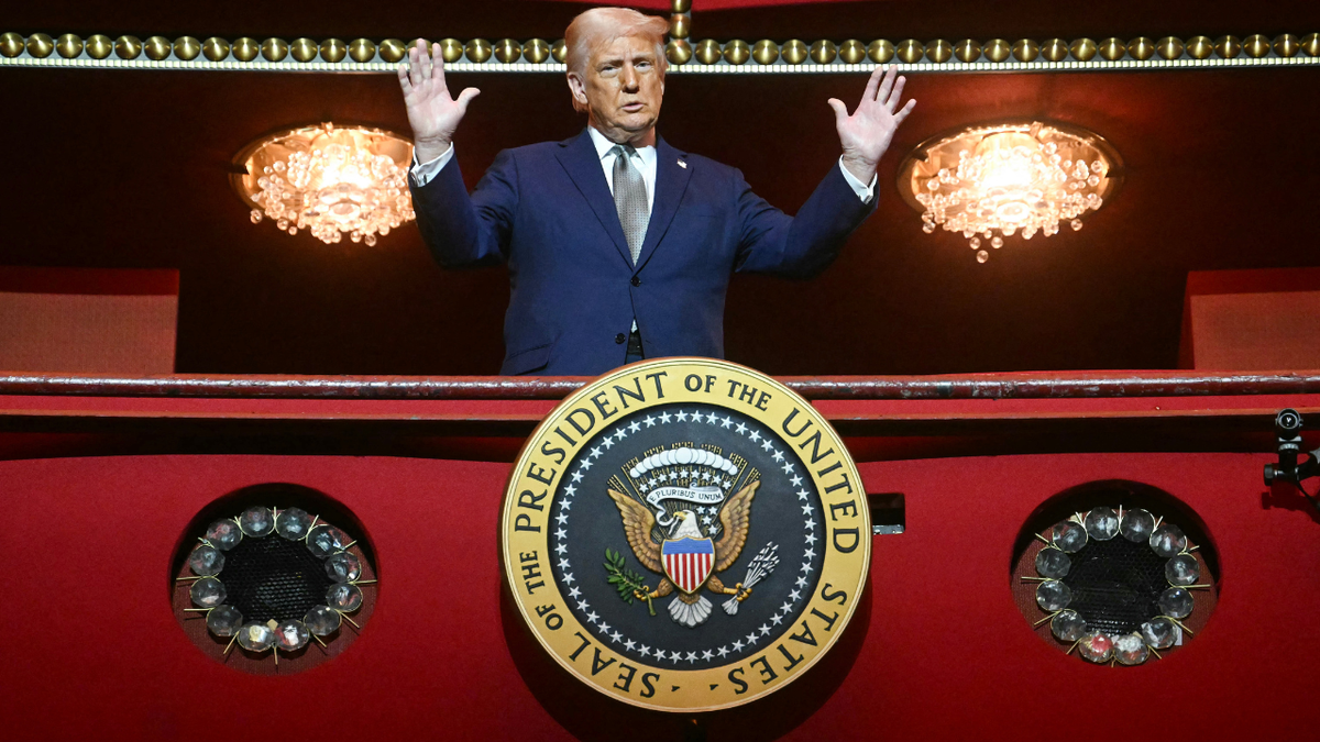 President Donald Trump stands in the presidential box as he tours the John F. Kennedy Center.
